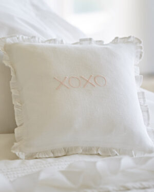 XOXO pink on white linen pillow