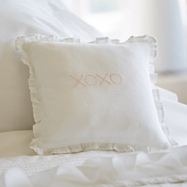 XOXO pink on white linen pillow