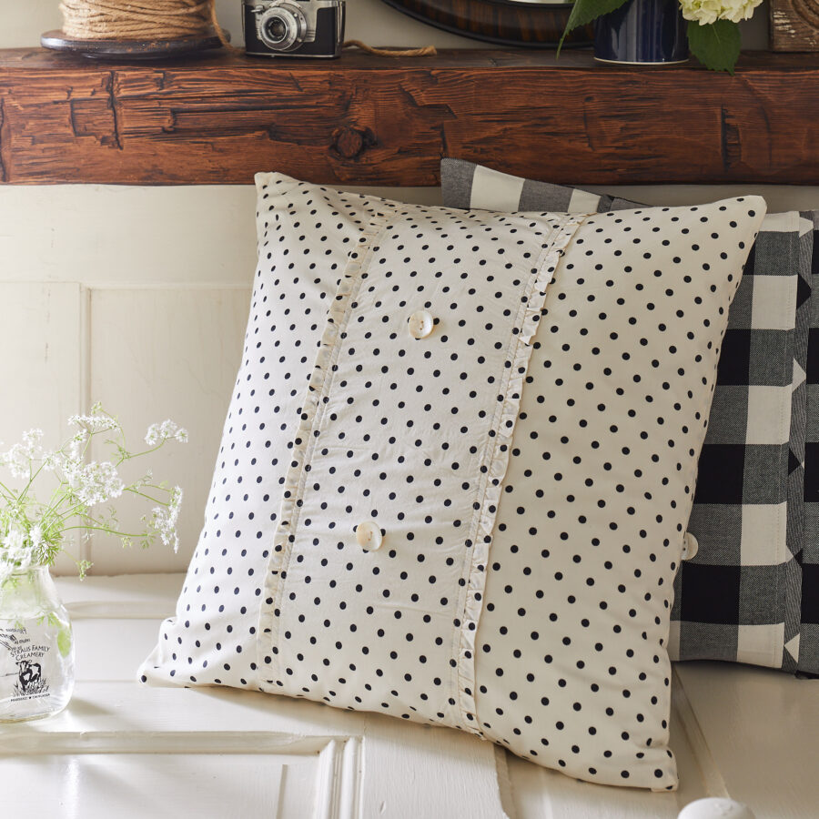 black polka dot porch pillow