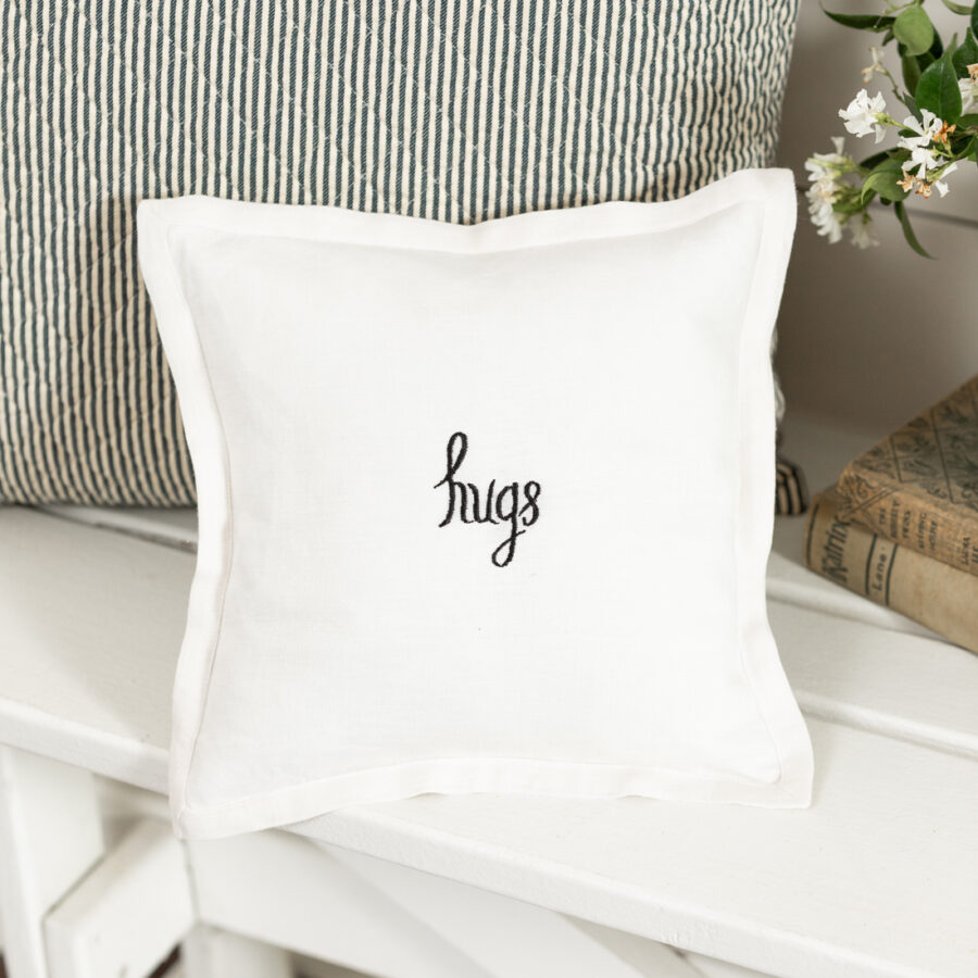 Hugs Black Embroidered on Cream Toss Pillow